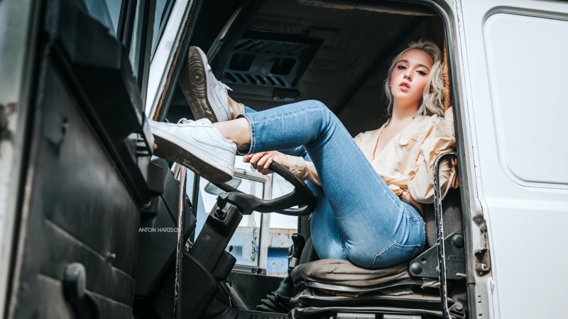 smiling, Nike, tattoo, blonde, sitting, women, lifestyles, travel, land vehicle, trucks, one person, young women, day, dyed hair, young adult, outdoors
