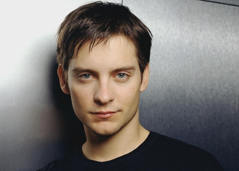 serious, looking at camera, portrait, gray, Guy, gray background, wall - building feature, hairstyle, body part, contemplation, Actor, adult, indoors, Tobey maguire