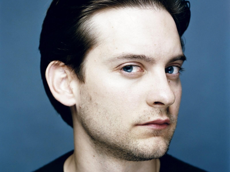 serious, human body part, human face, blue background, Tobey maguire, young men, Blue-eyed, headshot, men, close-up, indoors, one person, young adult, beard