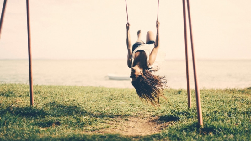 leisure activity, day, grass, sea, sport, outdoors, plant, sunlight, nature, swings, sky, women outdoors, upside down, 1080P, brunette, full length, one person