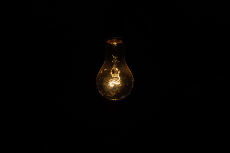 light bulb, glow, electricity, background, dark, illuminated, black background, filament, studio shot, electric light, close-up, power supply, light, no people