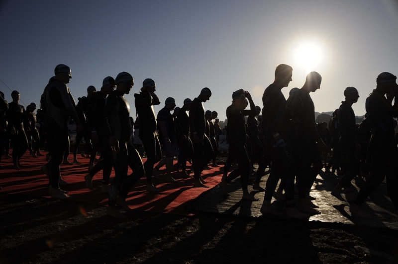 triathlon, sunlight, government, start, walking, group of people, man, real people, large group of people, back lit, sky, men, athletes, security, crowd