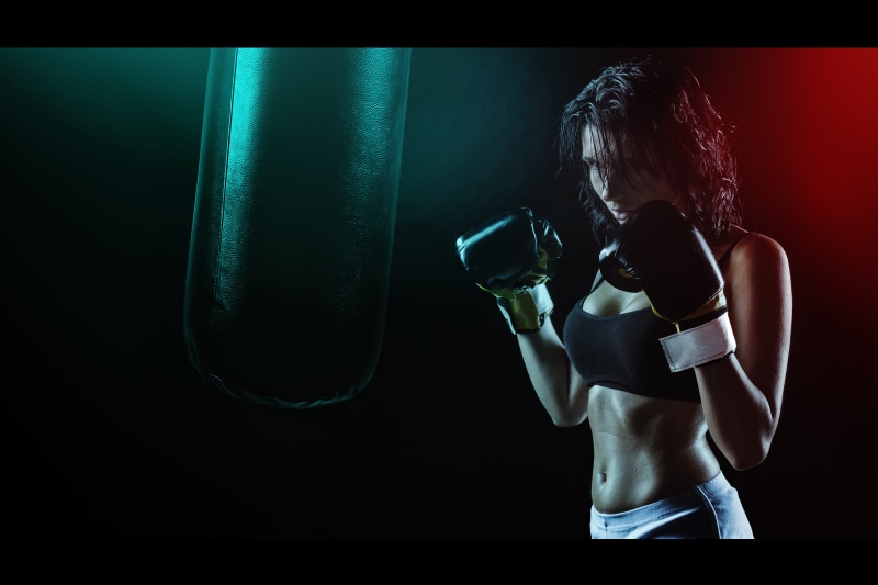 people, black background, healthy lifestyle, punching, exercising, girl, hitting, body, adult, wearing, woman, lifestyles, hairstyle, strength, indoors