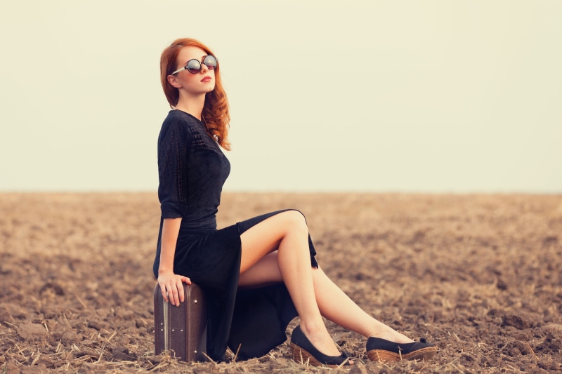 maxi, suitcase, sunglasses, 2K, land, sleeved, women outdoors, one person, adult, fashion, field, redhead, neck, beautiful woman, suit, black dress, glamour