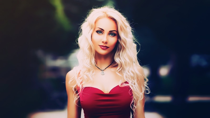 hair, focus on foreground, tight dress, curly hair, depth of field, fashion, real people, red, young women, adult, red dress, front view, long hair, hairstyle