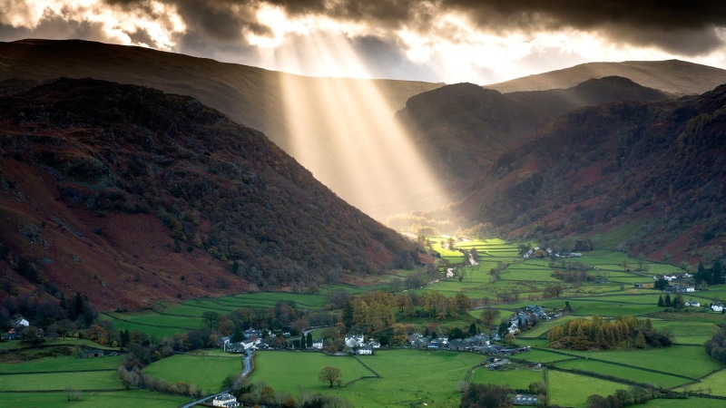 cloud - sky, environment, grass, village, valley, land, sky, outdoors, clouds, house, beauty in nature, illustration, mountains, sun rays, England, trees