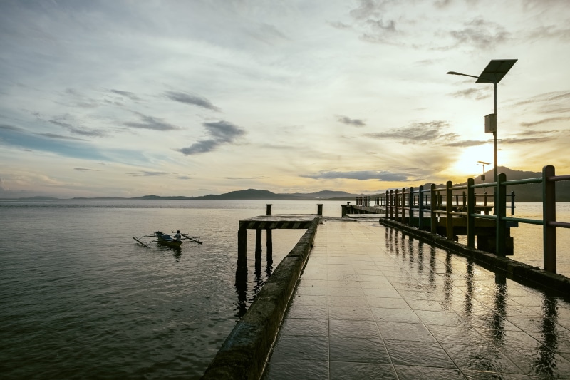 indo, beauty in nature, calm, manado, fisherman, water, post, lighting equipment, wet, cloud - sky, tranquility, sunlight, architecture, outdoors, street light