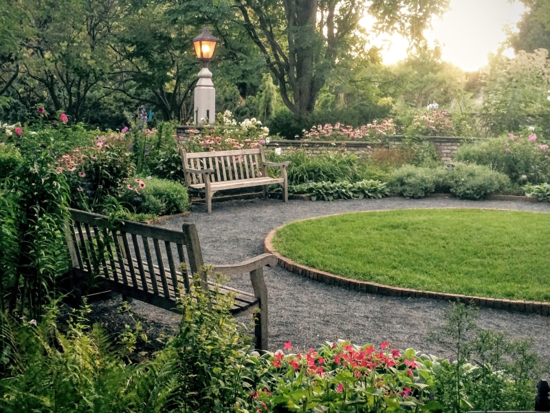 2K, day, tranquil, peaceful, arboretum, lighting equipment, building exterior, flowerbed, growth, plant, built structure, garden path, field, two, benches