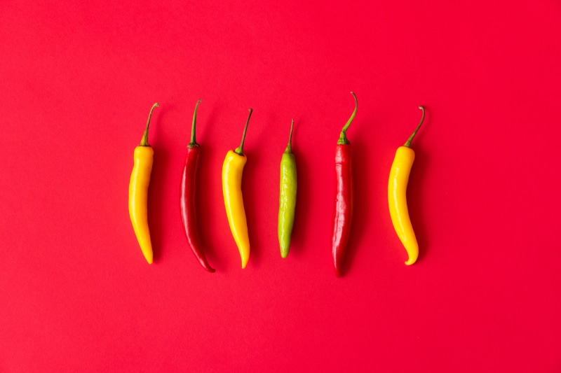 red, food and drink, peppers, foodie, studio shot, hot, garden, yellow, close-up, isolated, seasonings, yummy, chilli peppers, wellbeing, top, red background