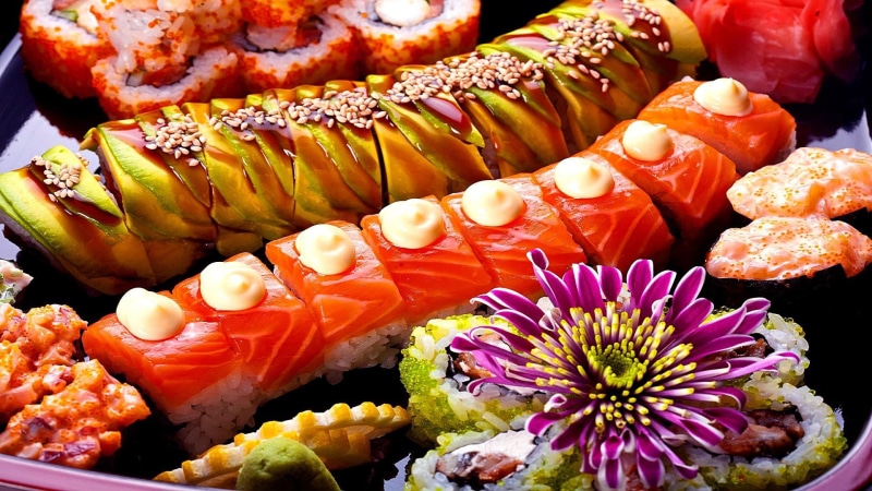 sushi roll, wellbeing, high angle view, no people, indoors, cuisine, garnish, ready-to-eat, orange color, sushi bowl, close-up, vegetable, freshness, fish