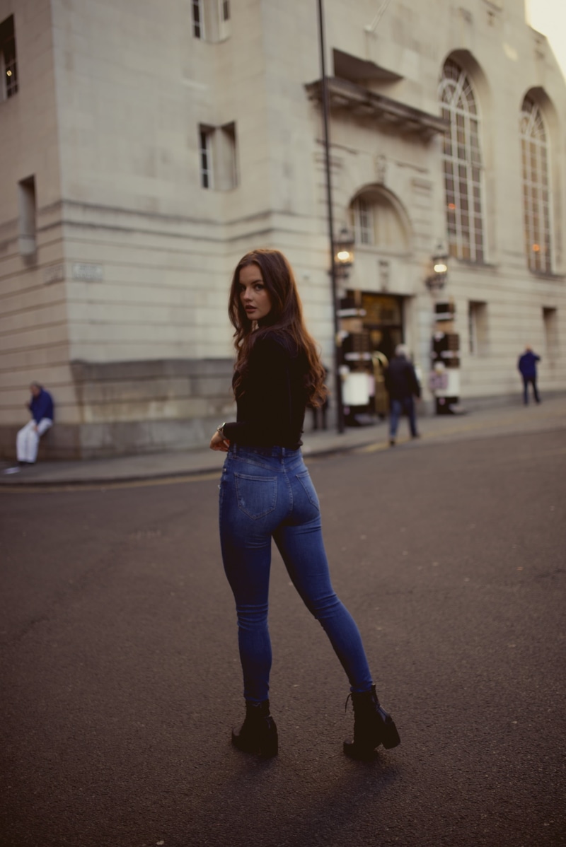 shirt, young women, beautiful woman, model, architecture, casual clothing, focus on foreground, blue, fitted, sleeved, black clothing, hairstyle, women outdoors