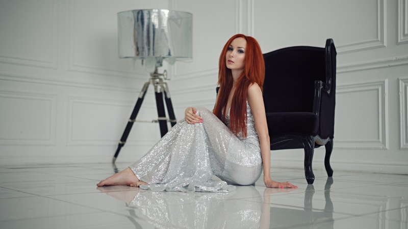 indoors, elegance, beautiful woman, dress, looking, getting dressed, woman, sitting, chair, sleeveless, on the floor, beauty, white, lifestyles, fashion