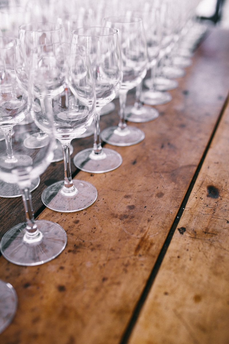 drinking Glass, selective focus, wood - material, party, day, wine glass, seat, plate, glass, home accesories, napkin, wine, glasses, celebration, focus on foreground