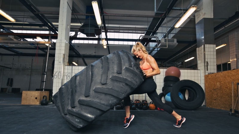 strength, effort, vitality, casual clothing, healthy lifestyle, one person, leisure activity, tires, built structure, clothing, indoors, full length, exercising