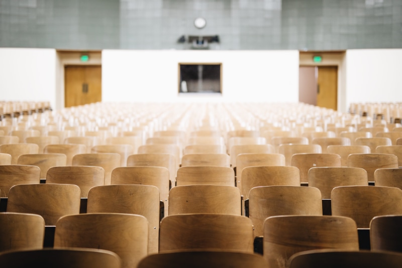 wooden, college, in a row, indoors, theater, focus on foreground, large group of objects, rows, absence, room, learning, inside, school, brown, wood - material