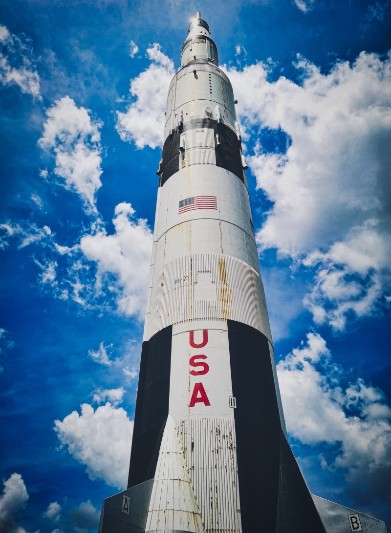 saturn v, blue, outdoors, cosmos, 2K, take off, science, nature, space travel, tower, rocket, building exterior, forward, city, mission, built structure