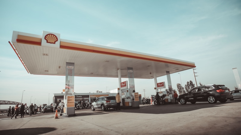 pump, vehicle, station, mode of transportation, housing, nature, group of people, shell, real people, automobile, day, refueling, vehicles, gas pump, incidental people