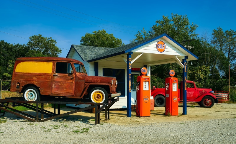 gas station, antique, land vehicle, hdr, day, yellow, outdoors, nature, blue, petrol, industry, cars, beside, building, 1080P, tree, gasoline, architecture