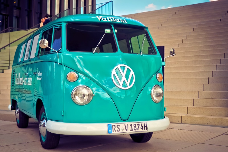 road, building exterior, day, green color, vw bulli, built structure, historically, motor vehicle, turquoise colored, land vehicle, bulli, van, street
