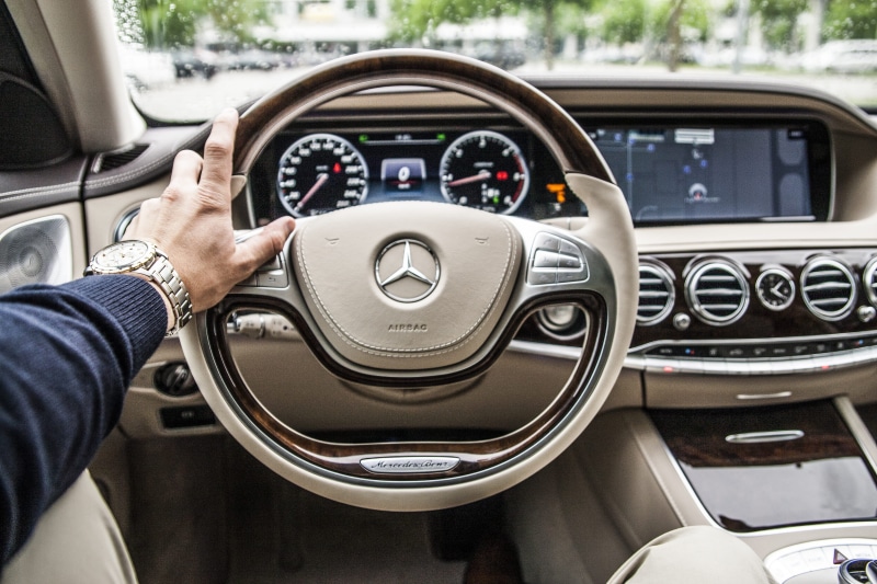hand, mercede, sitting, steering Wheel, mode of transportation, holding, inside, dashboard, driver, one Person, outdoors, Mercedes Benz, travel, person