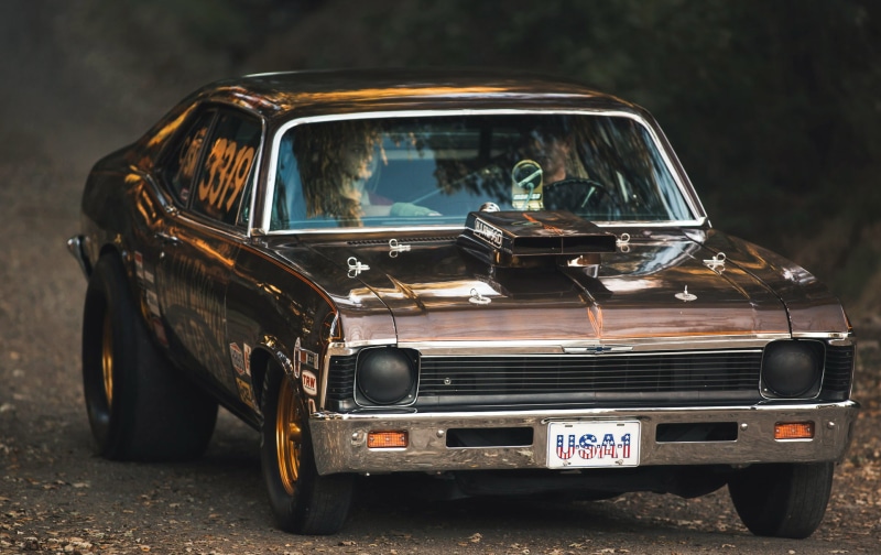 headlight, land vehicle, focus on foreground, day, race cars, transportation, stationary, Chevrolet, retro styled, city, luxury, transparent, street, depth of field