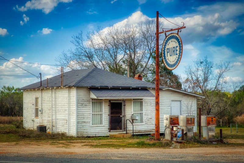 cloud - sky, transportation, outdoors, closed, nature, tree, city, no people, america, nostalgia, pure, abandoned, historic, landmark, building, petrol