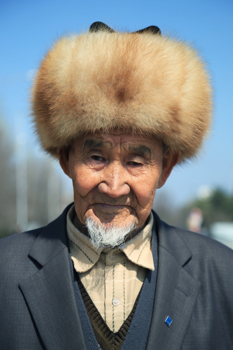 male, front view, kyrgyzstan, bishkek, brown, old, central asium, focus on foreground, wearing, 4K, day, lifestyles, smiling, real people, males, suit