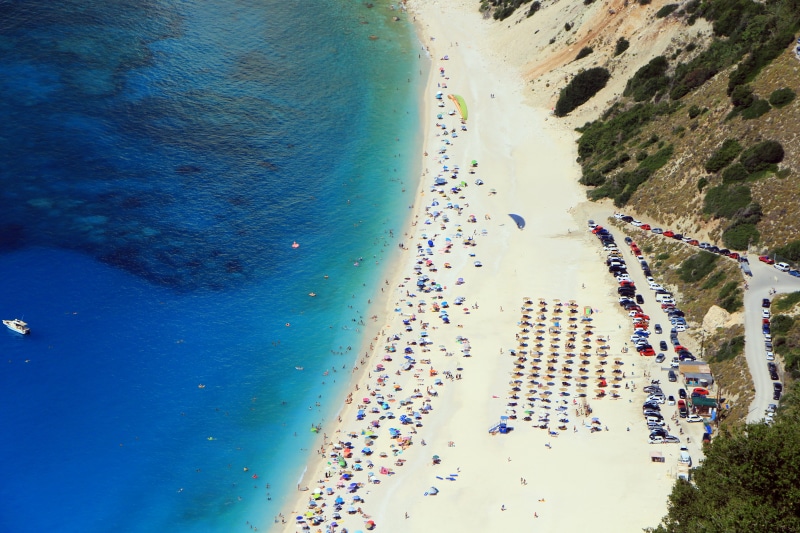 asphalt, myrtos beach, beauty in nature, sea, day, car, hotel, mode of transportation, scenics - nature, no people, highway, aerial view, seashore, landscape