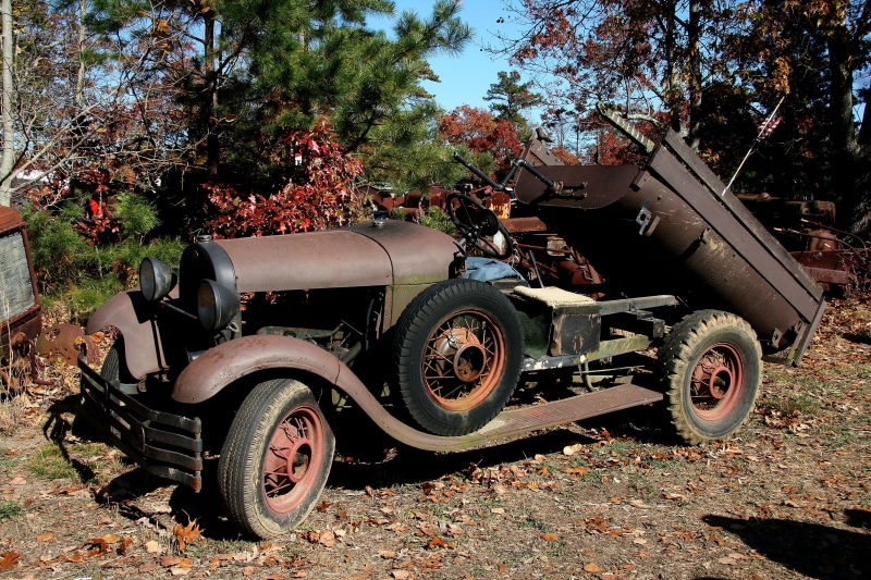 old car, antique, stationary, field, damaged, abandoned, sunlight, vintage, rusted, truck, plant, military, auto, classic, land, automotive, no people