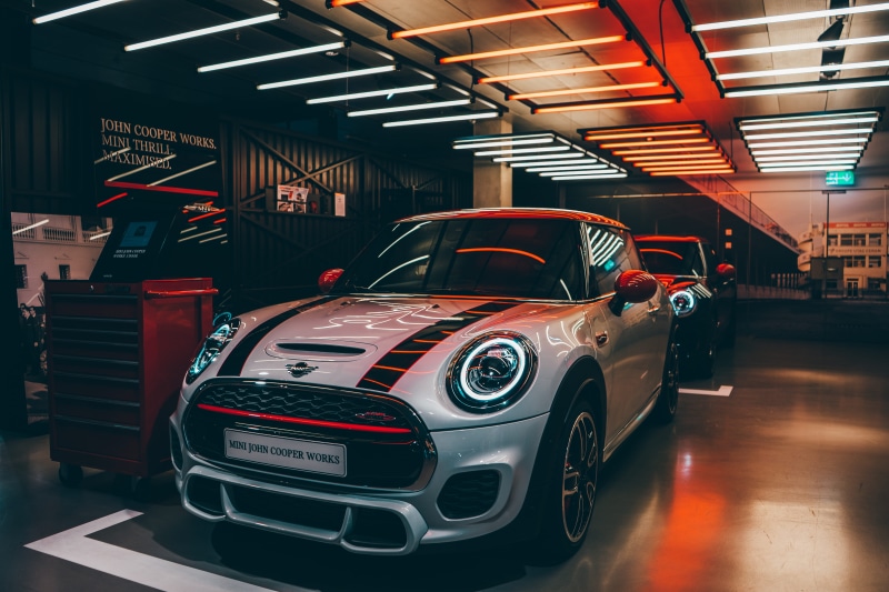 city, sports car, garage, sedan, stylish, vintage car, red, in a row, fast, land vehicle, indoors, Mini Cooper, mode of transportation, automobile, design