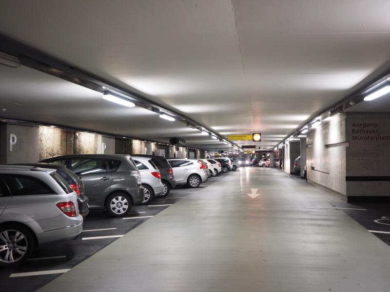 autos, park level, transportation, in a row, illuminated, architecture, cars, park, multi storey car park, alternate space, direction, land vehicle, lighting equipment