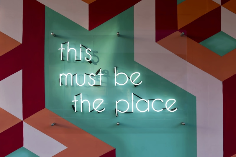 western script, design, art, white color, colourful, multi colored, number, geometric, wall, lights, 8K, sign, no people, graphic, shapes, signage, text