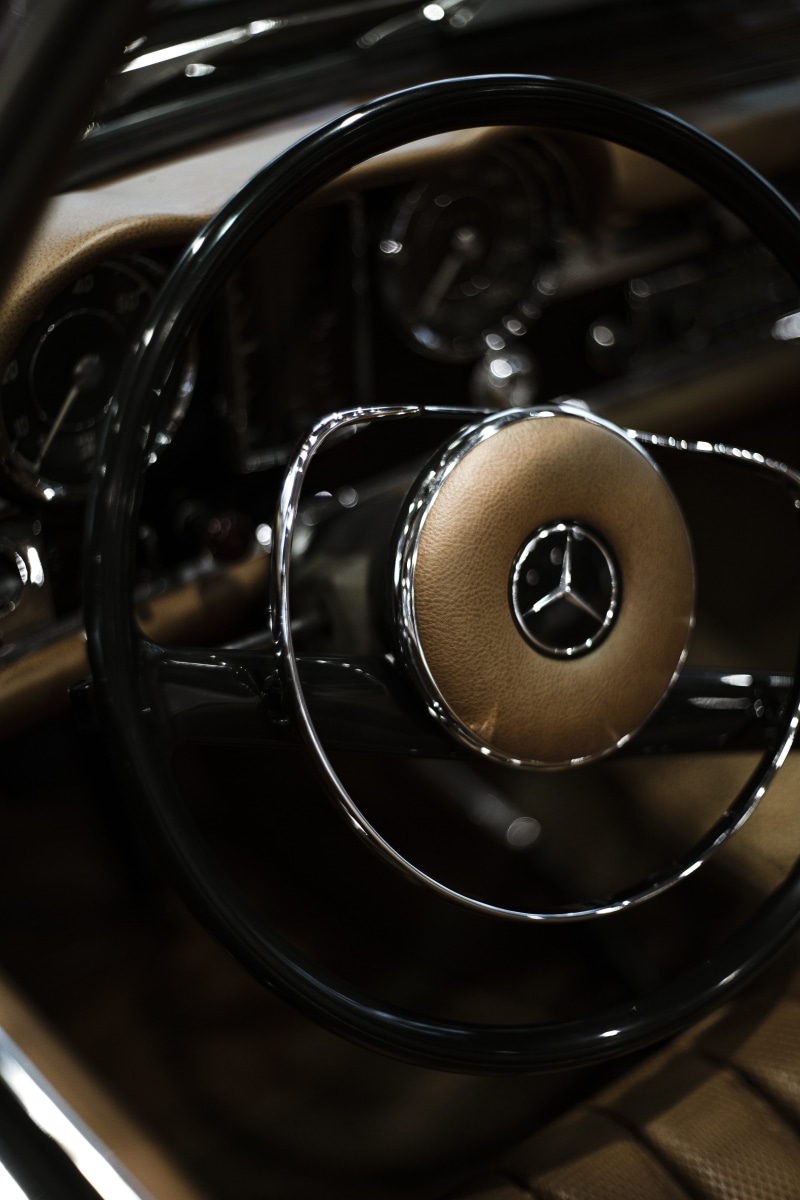 equipment, geometric shape, automobile, household equipment, close-up, steering wheel, black color, selective focus, shiny, still life, high angle view