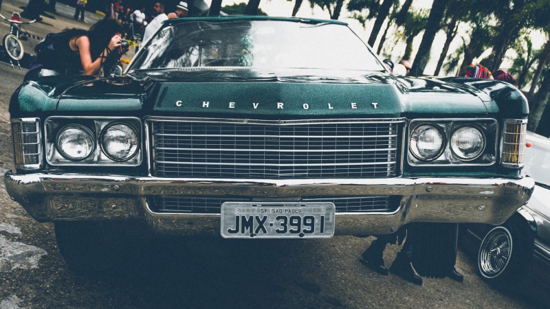 transportation system, old, style, windshield, auto, western script, vehicle, motor vehicle, front view, architecture, city, communication, people, retro styled