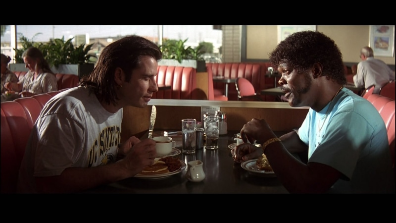 Samuel L. Jackson, John Travolta, food, sitting, alcohol, young adult, drink, restaurant, bar - drink establishment, togetherness, drinking, couple - relationship