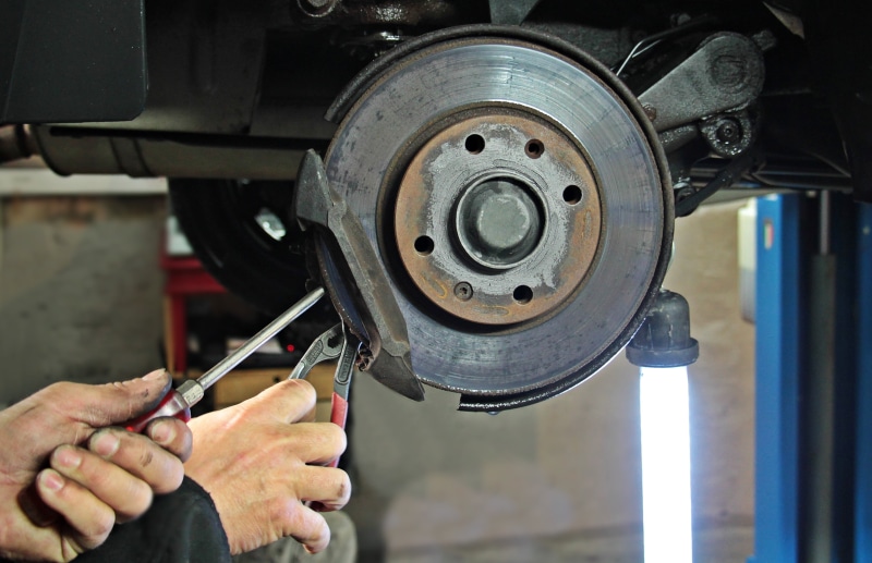 working, human hand, tire, red, lift, lamp, professional, pliers, auto, check, hand, focus on foreground, human body part, work, tool, person, mechanic