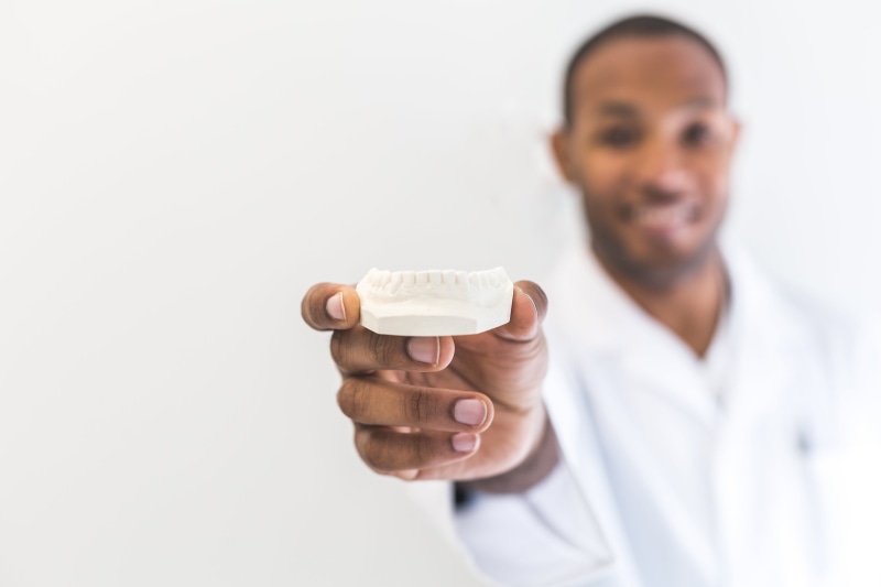 hold, medic, cheerful, blurred background, professional occupation, adult, person, uniform, science, dental mould, healthcare and medicine, specialist