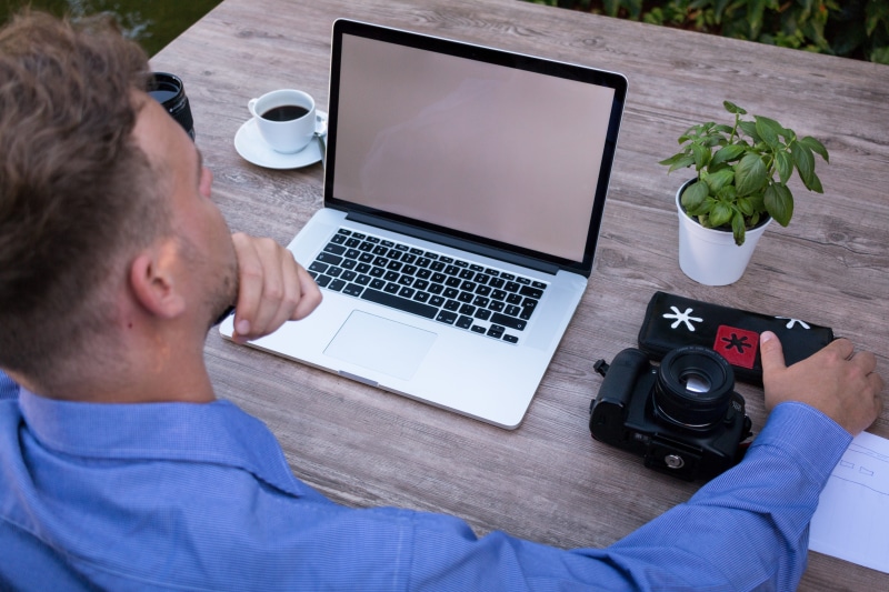considering, using laptop, lifestyle, office, using, designer, multimedia, white screen, casual, laptop, relaxed, over the shoulder, media specialist, young