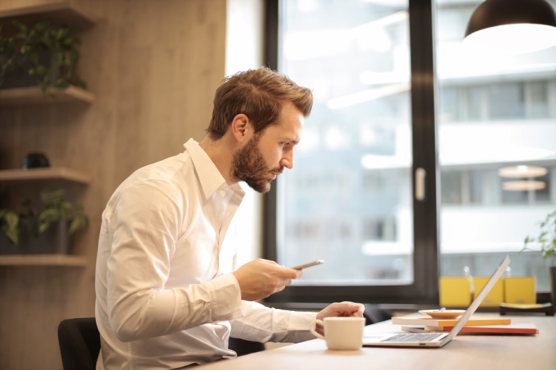 person, male, table, caucasian, Office, beard, determined, massaging, Sitting, plants, phone, internet, coffee, business person, pc, side view, check, computer