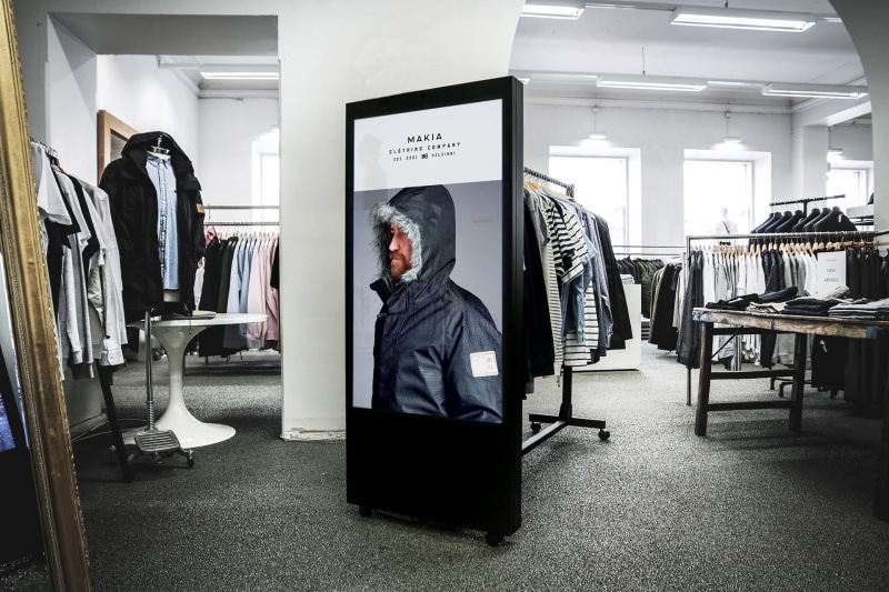 black, rack, boutique, consumerism, small business, men, adults only, one person, hoodie, rail, clothing rail, out-of-home, shopping, full length, indoors