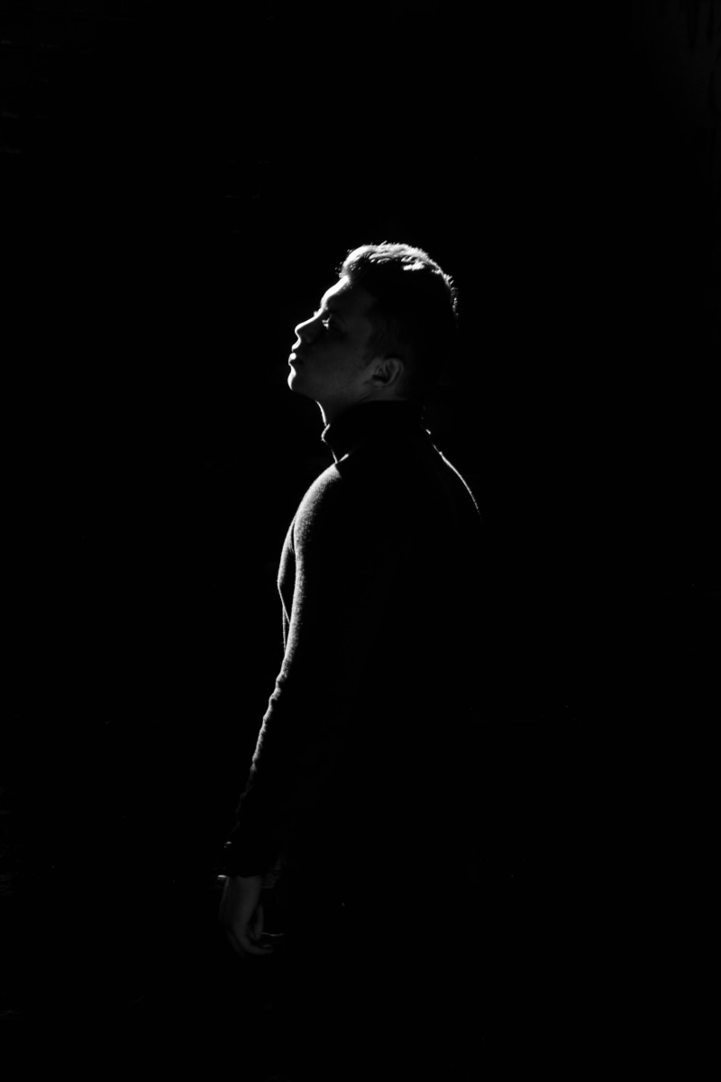 model, person, contemplation, side view, standing, profile view, adult, looking, leisure activity, black background, art, women, photoshoot, studio, young adult