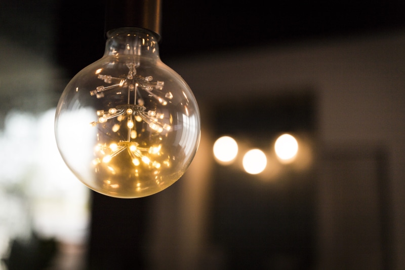 focus on foreground, light bulbs, glass items, clear, illuminated, spotlight, glowing, transparent, electric, blur, light bulb, incandescent, switched