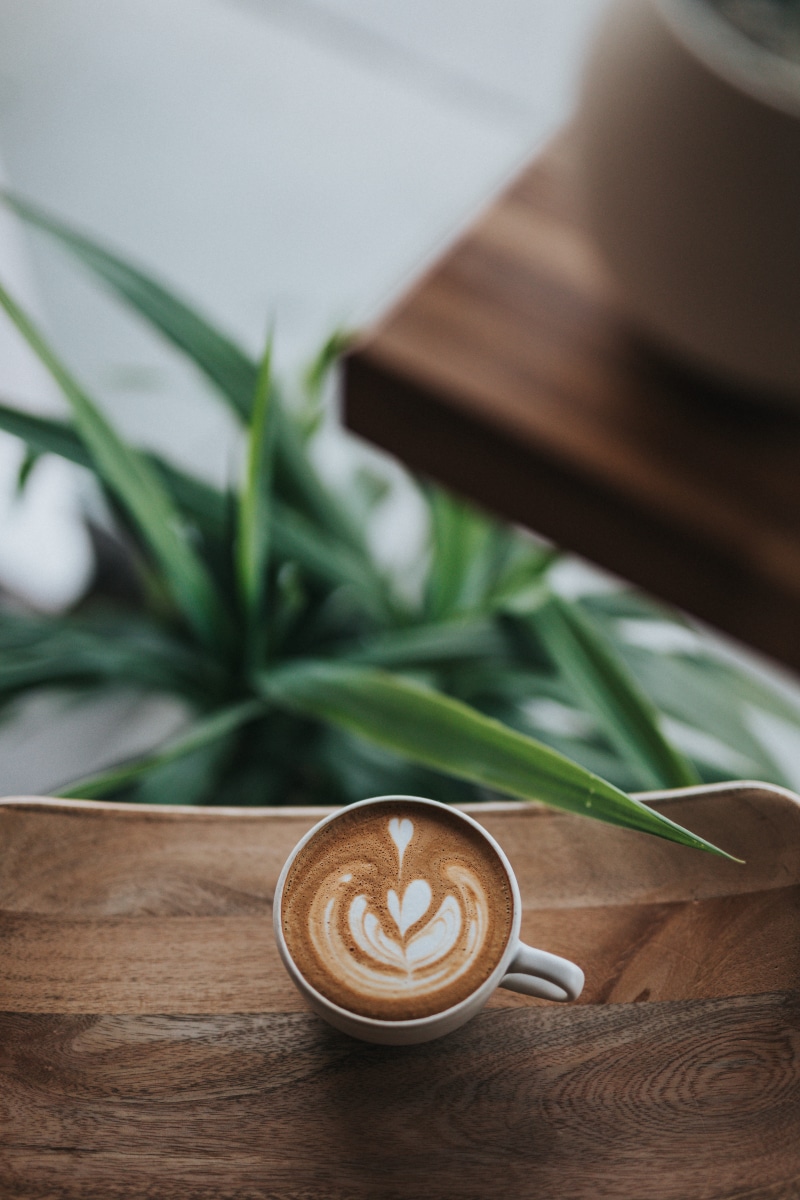 tilt, latte, cappuccino, photograph, indoors, creativity, table, wooden, modern coffee, froth art, coffee, modern, coffee mamn, coffee shop interior, crockery