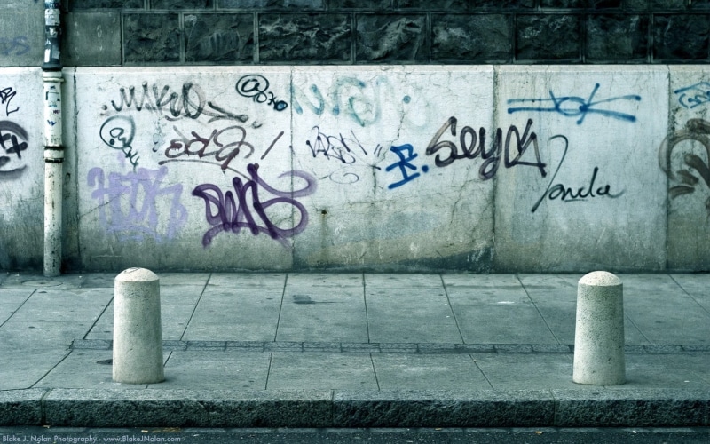 outdoors, city, western script, wall - building feature, graffiti, architectural column, street, street art, no people, wall, creativity, sidewalk, concrete