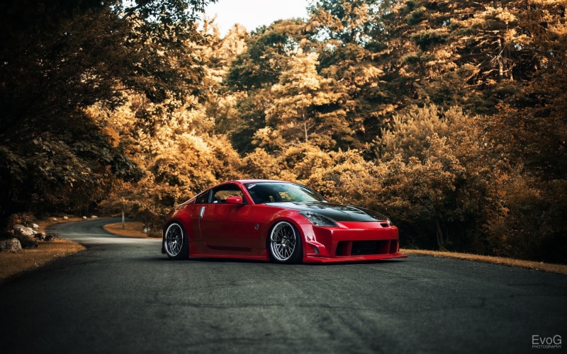 no people, plant, red, day, land vehicle, door, car, 1080P, hatchback, sunlight, change, outdoors, volkswagen, tree, Nissan 350Z, road, mode of transportation