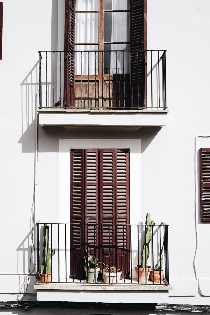 building, plants, wall, outdoors, built structure, near, balcony, house, door, nature, white color, glass - material, brown, building exterior, dor, railing
