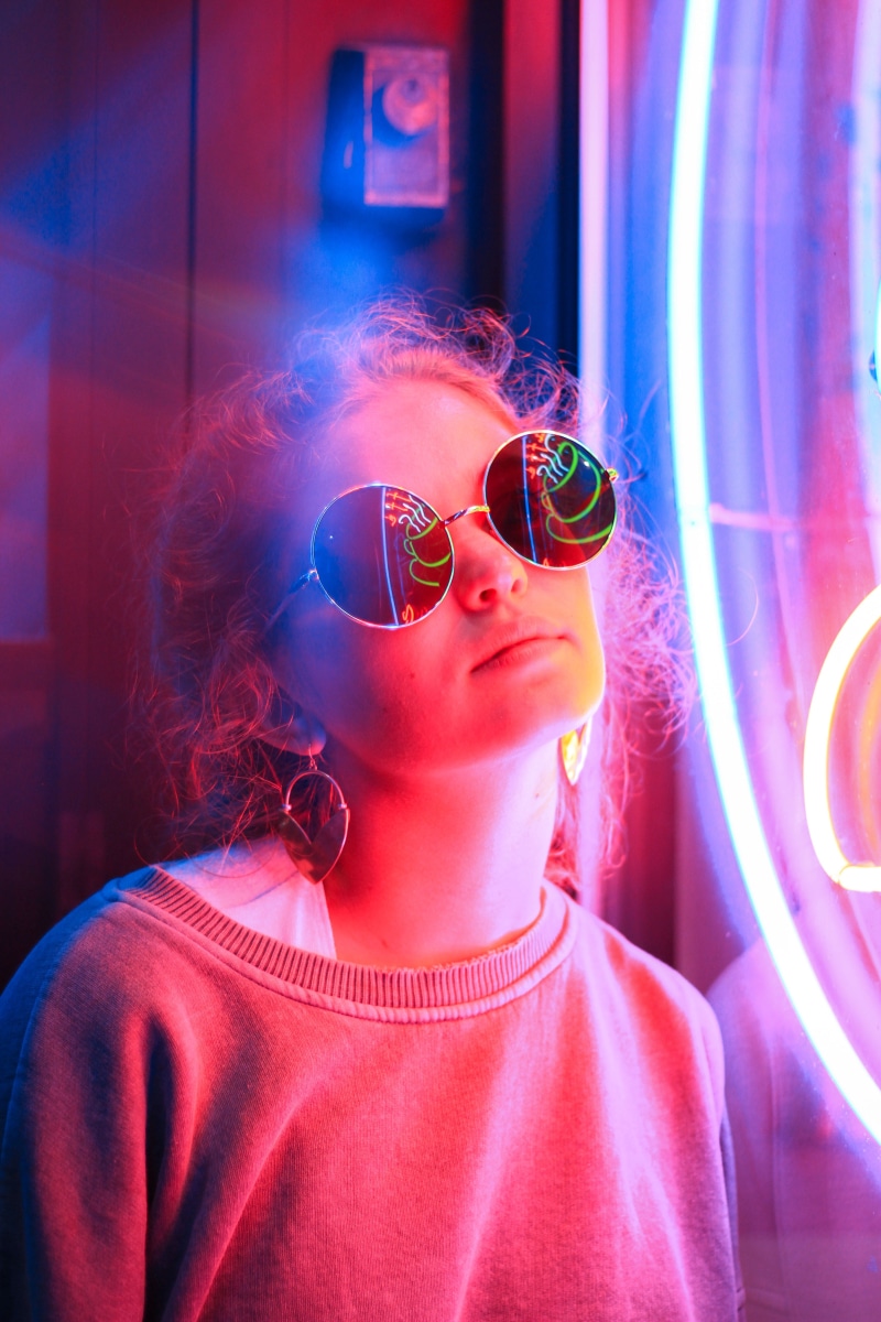 women, woman, beautiful woman, angle, sign, glass, adult, waist up, girl, illuminated, bright, headshot, light, florescent, young women, real people, sunglasses