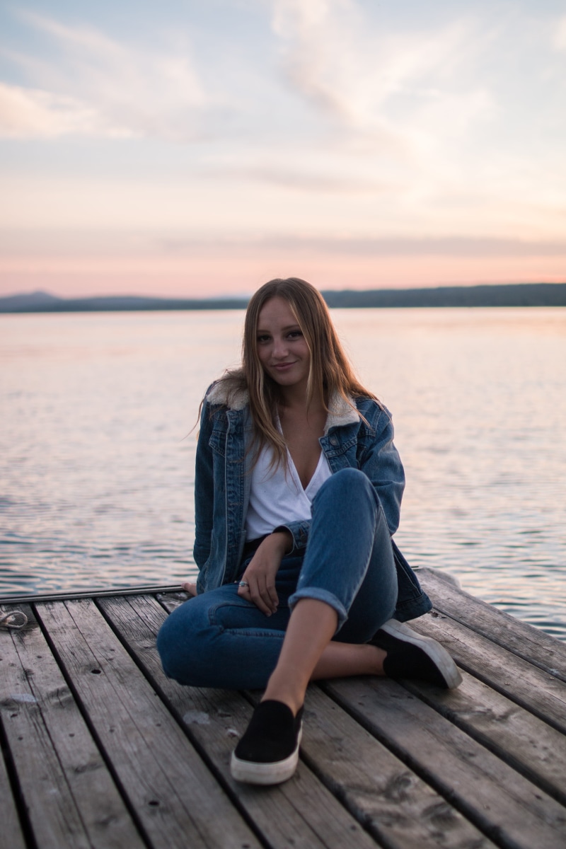 deck, neck, water, sea, lake, daytime, explore, leisure activity, woman, jeans, denim, outdoors, casual clothing, white, plank, beauty in nature, blue