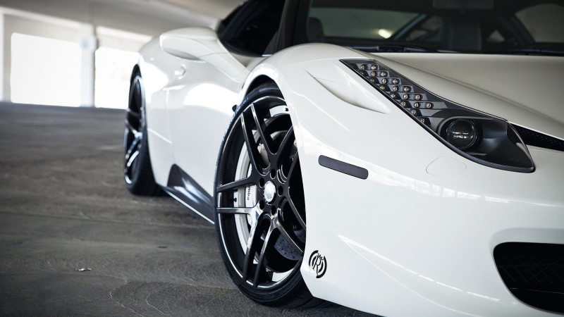 ferrari, transportation, metal, automobile industry, land vehicle, garage, motor vehicle, indoors, showroom, modern, spoke, stationary, wheel, focus on foreground