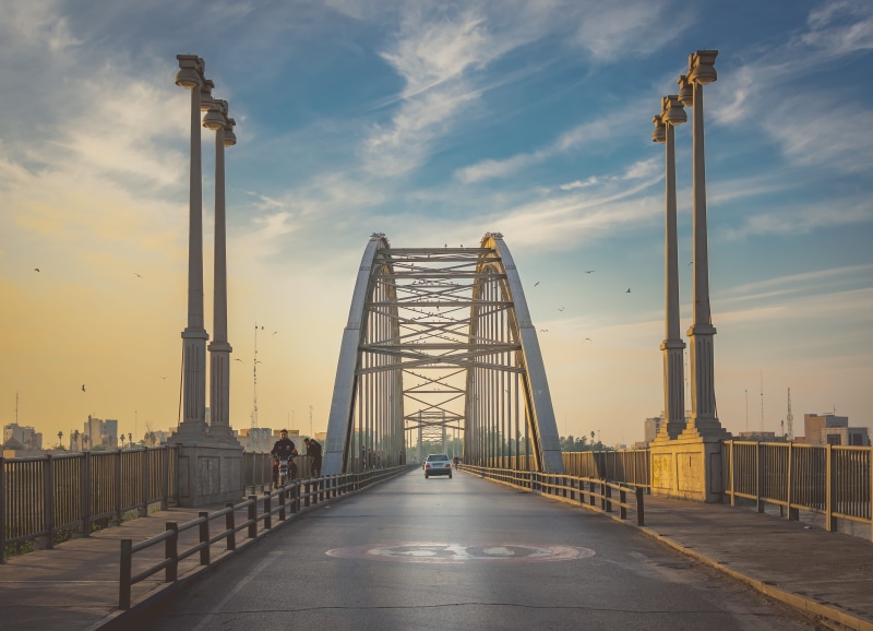 person, highway, road, way, bridge - man made structure, outdoors, the way forward, arch, boardwalk, waterfront, cloud - sky, building exterior, arched